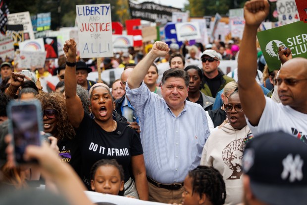 Gov. JB Pritzker and Lt. Gov. Juliana Stratton attend a No Kings rally in Grant Park on Oct. 18, 2025 in Chicago. (Armando L. Sanchez/Chicago Tribune)