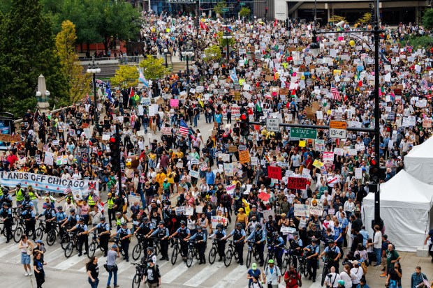 People march downtown during a No Kings rally in response to President Donald Trump's increased immigration enforcement actions in the area, Oct. 18, 2025 in Chicago. (Armando L. Sanchez/Chicago Tribune)