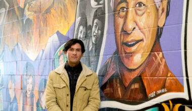 Eduardo Chavez stands next to a mural of his grandfather, labor leader Cesar Chavez. (Monica Carrillo-Casas/The Spokesman-Review)