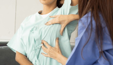Woman having breast cancer examination from a doctor.