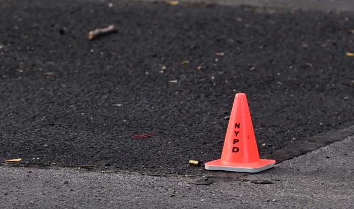 A shell casing lies on the ground in the parking lot of Cooper Park Houses 