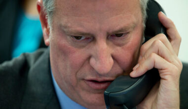 FILE - Then-New York City Mayor Bill de Blasio takes a phone call during the 14th Annual CUNY/Daily...