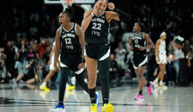 Aces center A'ja Wilson (22) and guard Chelsea Gray (12) celebrate during their Game 5 win over Indiana Tuesday night in Las Vegas.