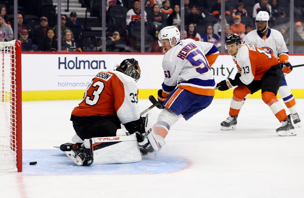 Emil Heineman scores the game-winning goals past Samuel Ersson during the third period of the Islanders' 4-3 preseason win over the Flyers on Oct. 2, 2025.
