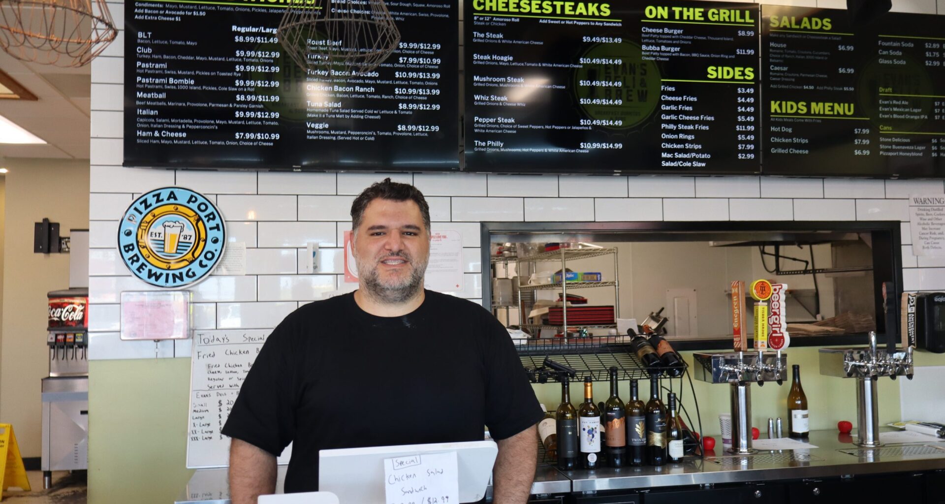 Sandwiches and cheesesteaks at Evan’s Deli & Brew in Midway District