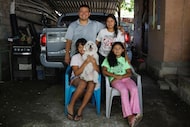 Salvadoran nationals Yessenia Ruano and her husband, Miguel Guerra, pose for a photograph...