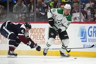 Dallas Stars right wing Mikko Rantanen, right, collects the puck as Colorado Avalanche...