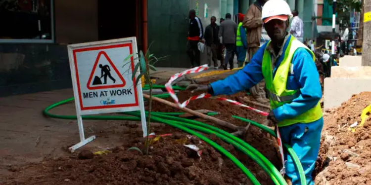 A Technician Installing Fibre Optic Cables. Photo/Kbc Safaricom