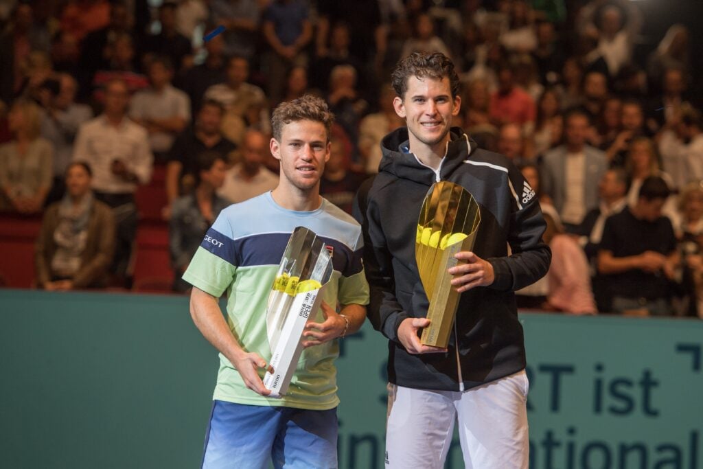 Diego Schwartzman and Dominic Thiem holding their trophies after the Vienna Open final in 2019.