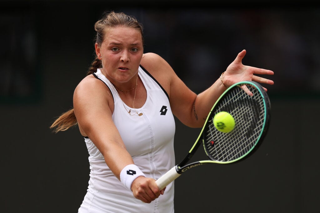 Jule Niemeier of Germany plays a backhand against Tatjana Maria of Germany during their Women's Singles Quarter Final match on day nine of The Championships Wimbledon 2022 at All England Lawn Tennis and Croquet Club.