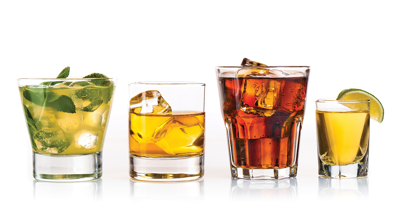 Three alcoholic cocktails and tequila shot