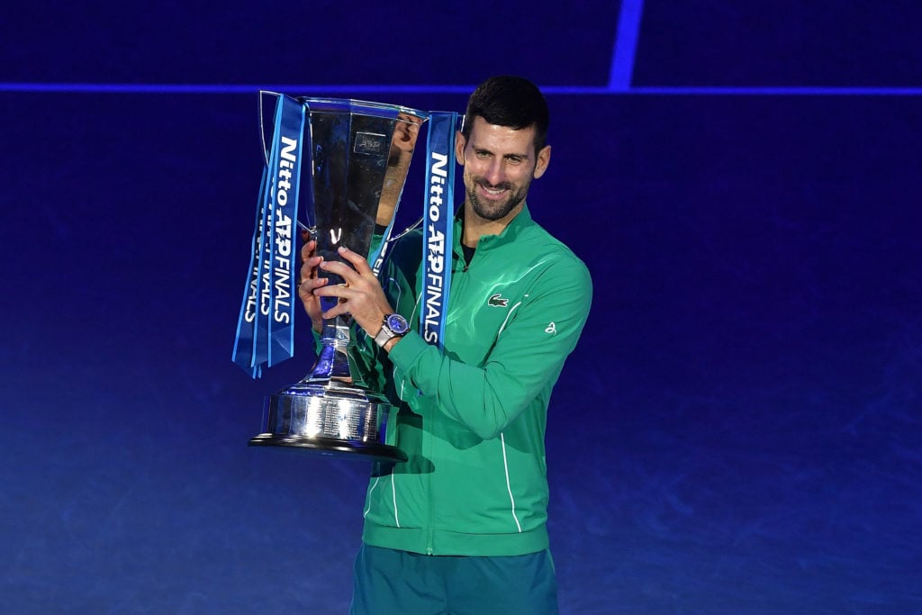 Novak Djokovic of Serbia poses for a photo with the Nitto ATP Finals trophy after victory against Jannik Sinner of Italy in the Men's Singles Finals between Jannik Sinner of Italy and Novak Djokovic of Serbia on day eight of the Nitto ATP Finals at Pala Alpitour.