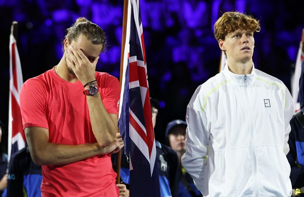Winner Jannik Sinner of Italy and runner-up Alexander Zverev of Germany shows his emotion as they wait for the Men's Singles trophy presentation following the Men's Singles final during day 15 of the 2025 Australian Open at Melbourne Park.