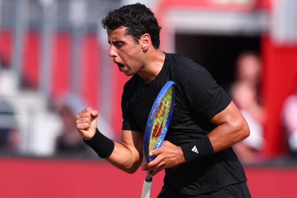 Jaume Munar celebrates a point against Carlos Alcaraz at Queen's in 2025