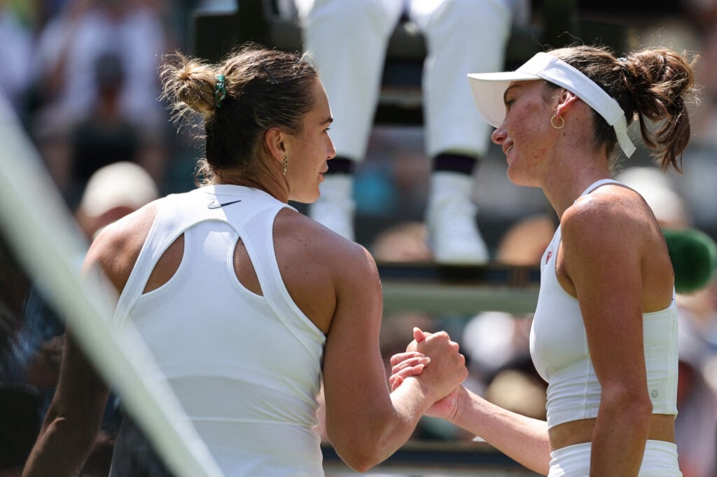 Aryna Sabalenka shakes hands with Carson Branstine after their first-round match at Wimbledon in 2025