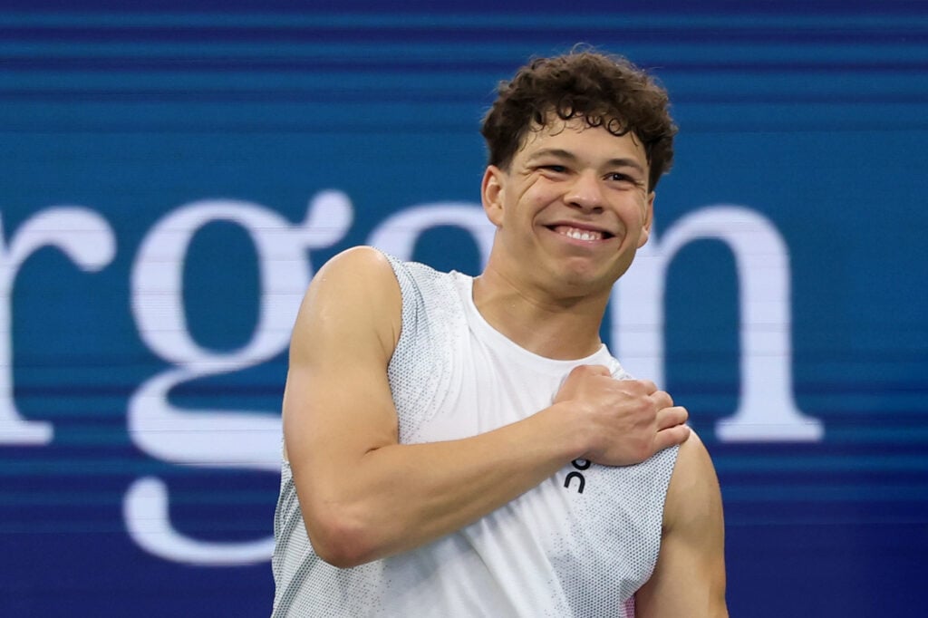 Ben Shelton of the United States gestures towards his shoulder during the fourth set against Adrian Mannarino of France during their Men's Singles Third Round match on Day Six of the 2025 US Open at USTA Billie Jean King National Tennis Center.