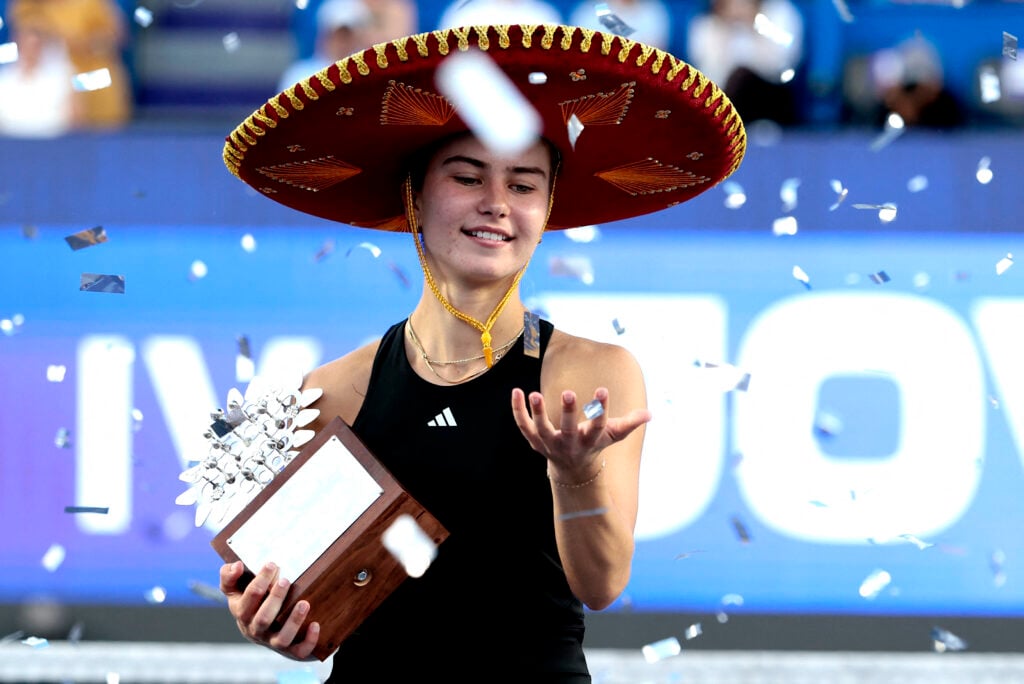 Iva Jovic celebrates with the trophy after winning the women's singles final match of the 2025 WTA Guadalajara Open against Colombia's Emiliana Arango in Zapopan, Mexico.