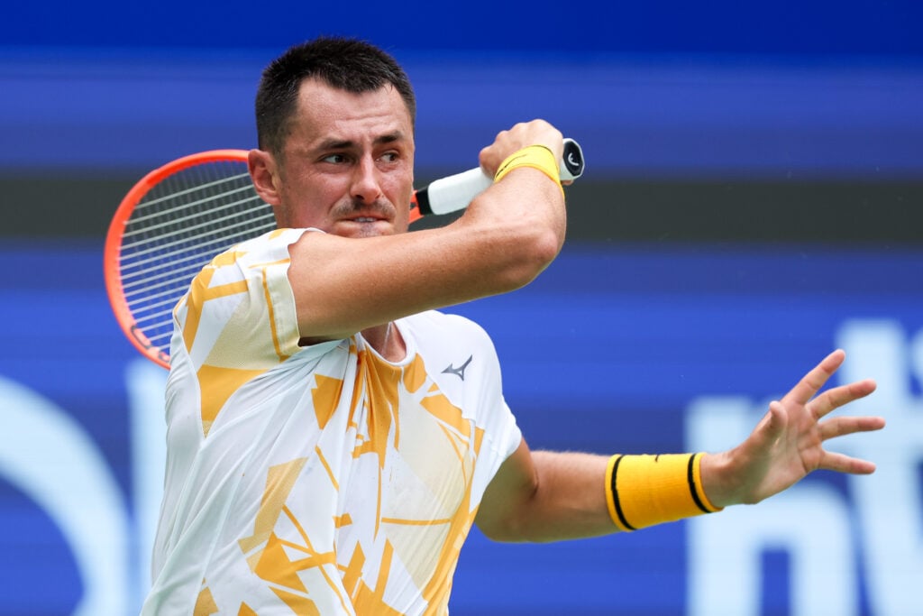 Bernard Tomic of Australia competes against Tristan Schoolkate of Australia during men's singles qualifying Round 1 at Sichuan International Tennis Center.