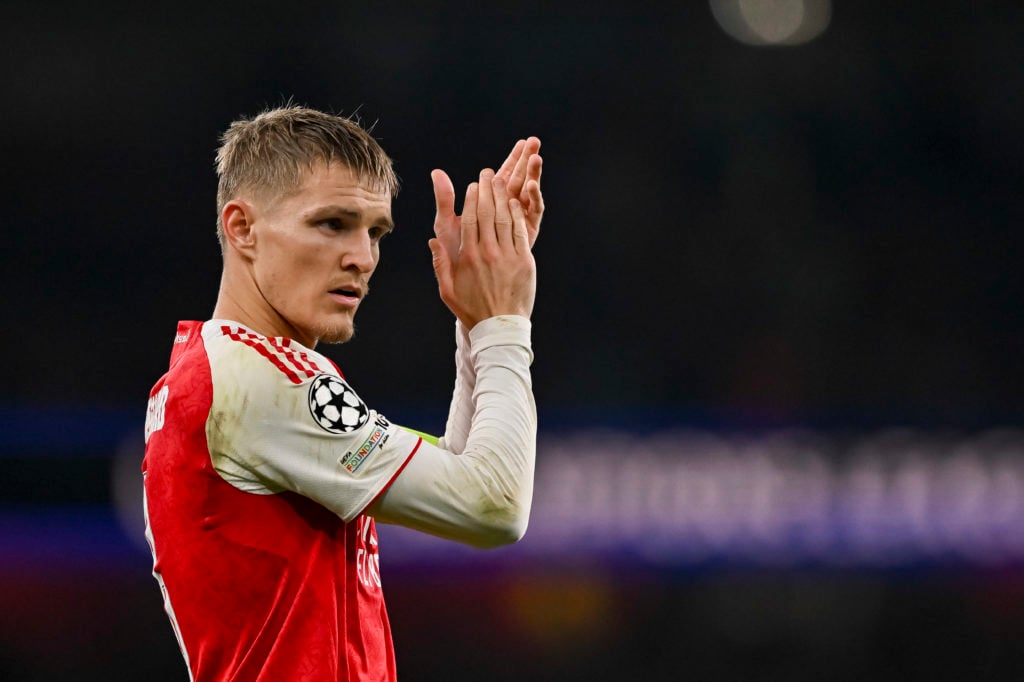 Arsenal captain Martin Odegaard applauds fans v Olympiacos FC