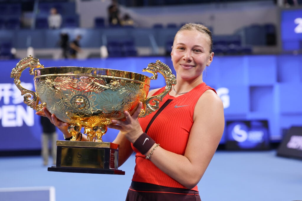 Amanda Anisimova of the United States poses with her winner's trophy during medal ceremony after winning the Women's Singles Final match against Linda Noskova of Czech Republic on day 14 of 2025 China Open at National Tennis Center.