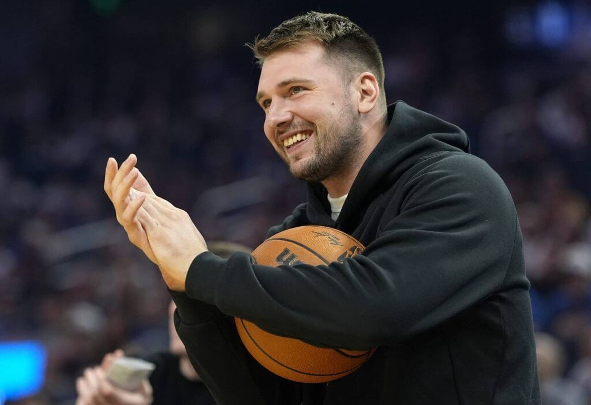 Luka Dončić looks on during a preseason game against the Golden State Warriors.