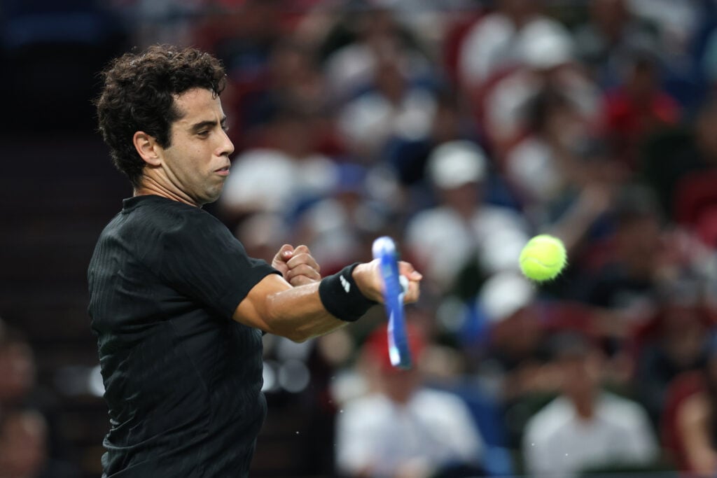 Jaume Munar hits a forehand against Novak Djokovic at the 2025 Shanghai Masters