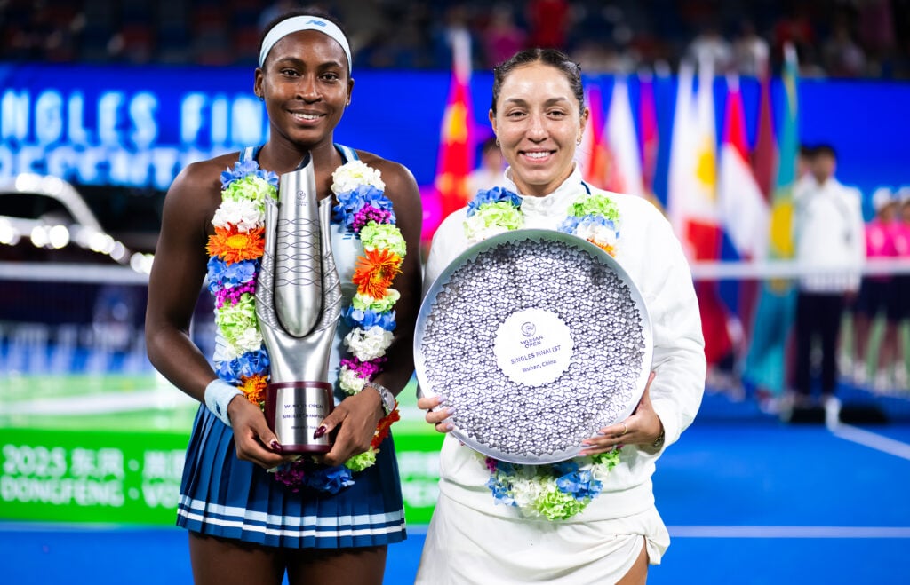 Coco Gauff and Jessica Pegula pose with their trophies after their 2025 Wuhan Open final