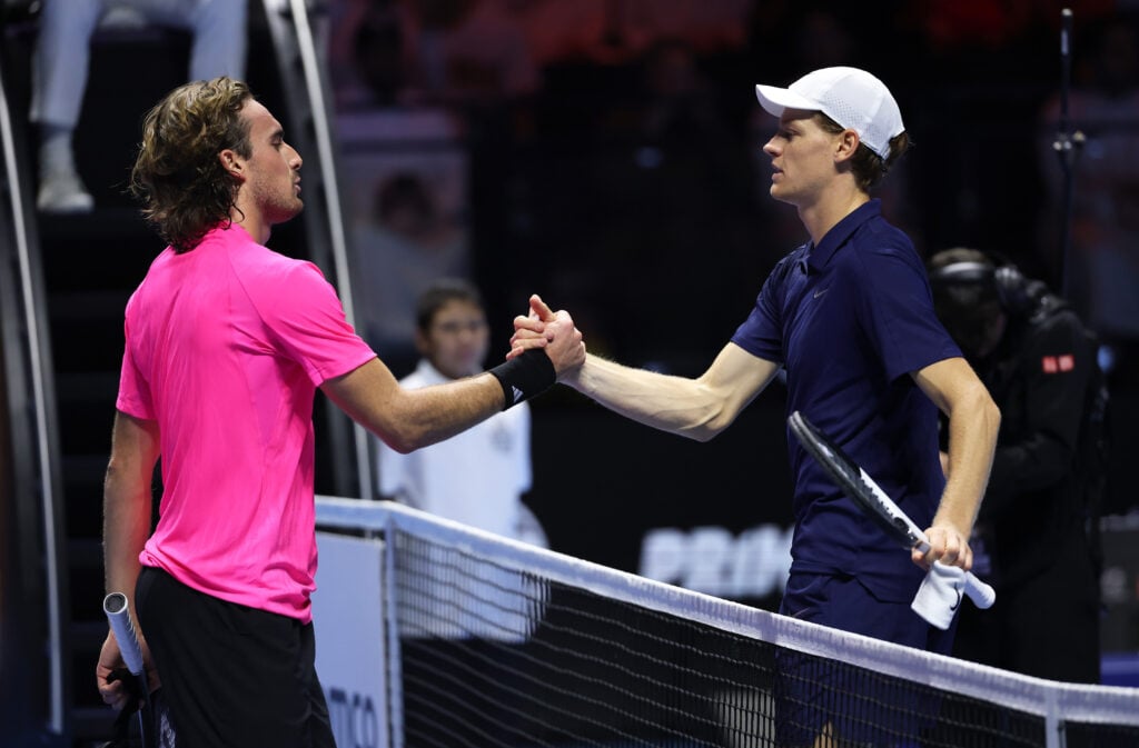 Jannik Sinner of Italy shakes hands at the net after his straight sets victory against Stefanos Tsitsipas of Greece in their quarterfinal match during day one of the Six Kings Slam 2025 at ANB Arena.