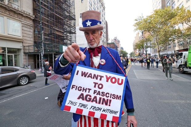 Protesters rally during the "No Kings" national day of protest in New York City on October 18, 2025. From New York to San Francisco, millions of Americans are expected to hit the streets to voice their anger over President Donald Trump's policies at nationwide "No Kings" protests. (Photo by TIMOTHY A.CLARY / AFP) (Photo by TIMOTHY A.CLARY/AFP via Getty Images)