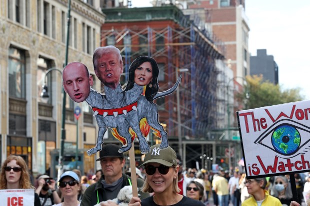 Protesters rally during the "No Kings" national day of protest in New York City on October 18, 2025. From New York to San Francisco, millions of Americans are expected to hit the streets to voice their anger over President Donald Trump's policies at nationwide "No Kings" protests. (Photo by TIMOTHY A.CLARY / AFP) (Photo by TIMOTHY A.CLARY/AFP via Getty Images)