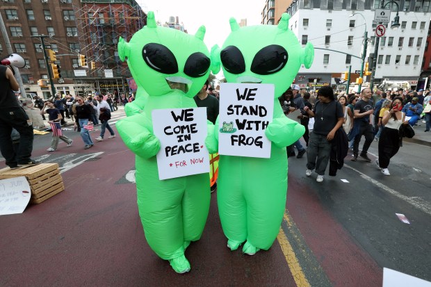 TOPSHOT - Protesters rally during the "No Kings" national day of protest in New York City on October 18, 2025. From New York to San Francisco, millions of Americans are expected to hit the streets to voice their anger over President Donald Trump's policies at nationwide "No Kings" protests. (Photo by TIMOTHY A.CLARY / AFP) (Photo by TIMOTHY A.CLARY/AFP via Getty Images)