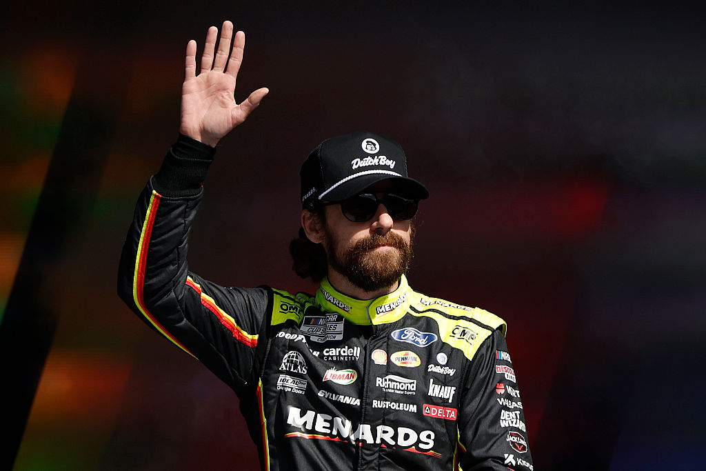 TALLADEGA, ALABAMA - OCTOBER 19: Ryan Blaney, driver of the #12 Menards/Dutch Boy Ford, waves to fans as he walks onstage during driver intros prior to the NASCAR Cup Series YellaWood 500 at Talladega Superspeedway on October 19, 2025 in Talladega, Alabama.