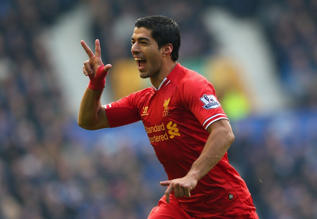 Luis Suarez of Liverpool celebrates scoring his team's second goal during the Barclays Premier League match between Everton and Liverpool at Goodison Park