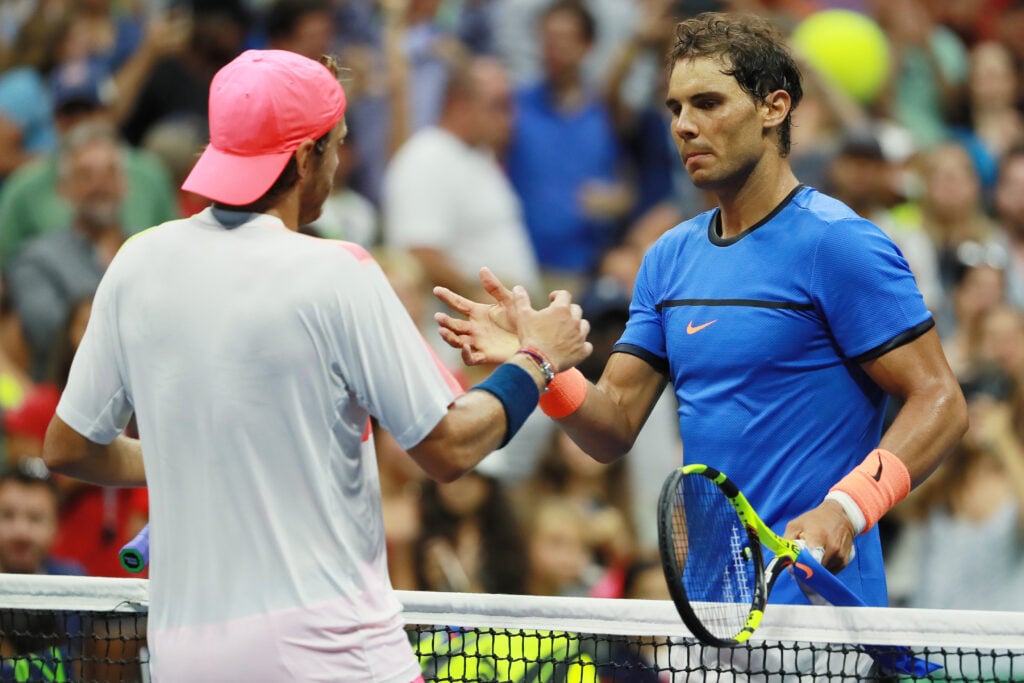 Lucas Pouille of France shakes hands after defeating Rafael Nadal of Spain during his fourth round Men's Singles match on Day Seven of the 2016 US Open at the USTA Billie Jean King National Tennis Center on September 4, 2016 in the Flushing neighborhood of the Queens borough of New York City.