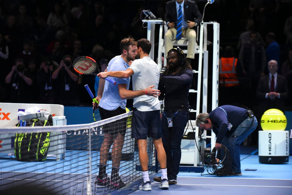 Grigor Dimitrov and Jack Sock embrace after their semifinal match at the 2017 ATP Finals