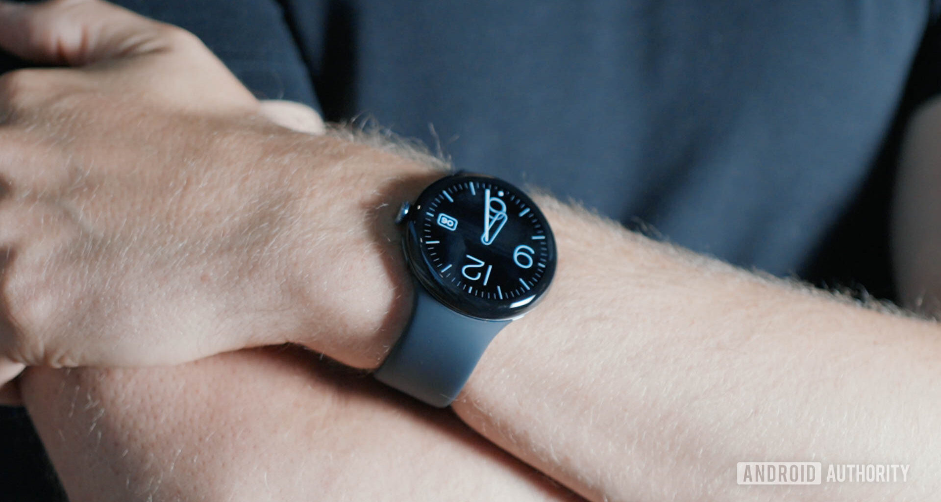 A Pixel Watch 3 on a user's wrist display the time.