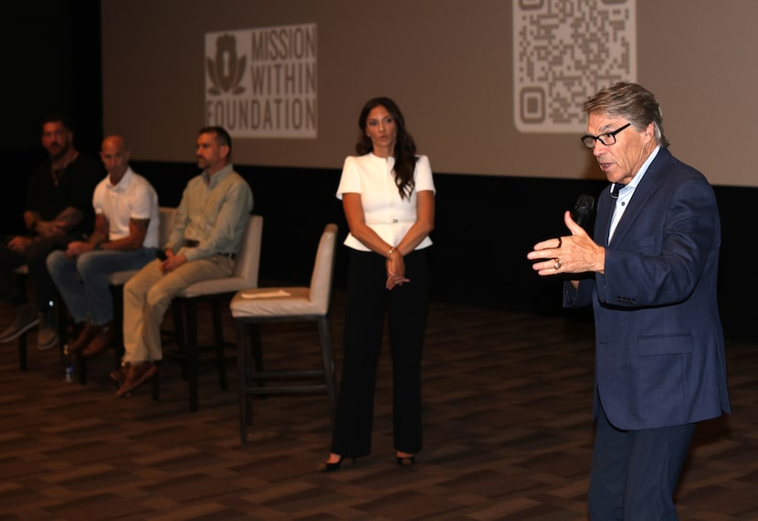 Rick Perry (right) speaks during a panel discussion at Cinépolis Luxury Cinemas in Dallas on...