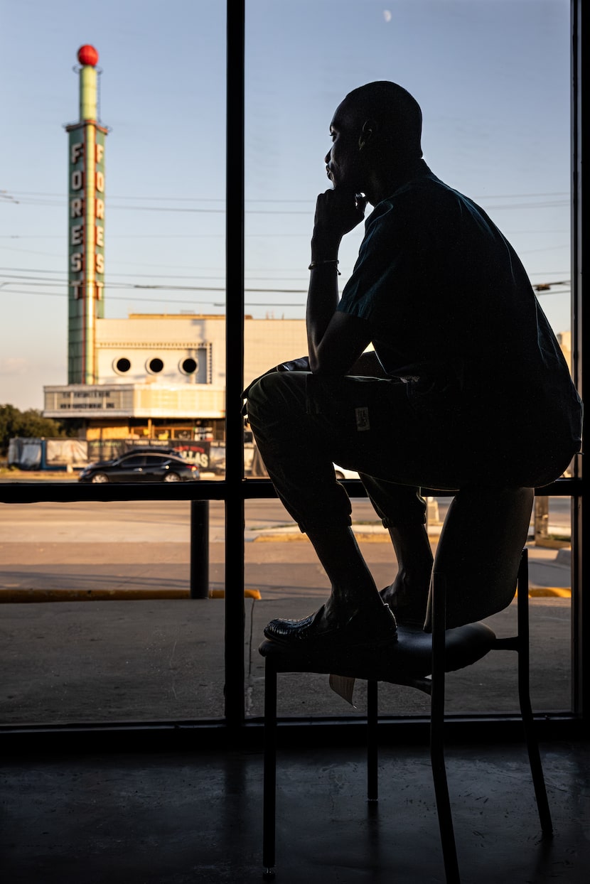 Nijeul X, executive and artistic director of the Forest Theater, looks out the window of the...