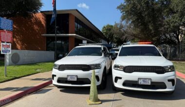 Police vehicles outside of an ICE facility in Dallas. (Spectrum News 1/Lauren Rangel)