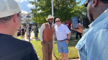 Grammy-winning artist Leon Bridges poses for pictures with fans in Fort Worth after a ceremony unveiling street toppers in his name. (NBC DFW/Tahera Rahman)