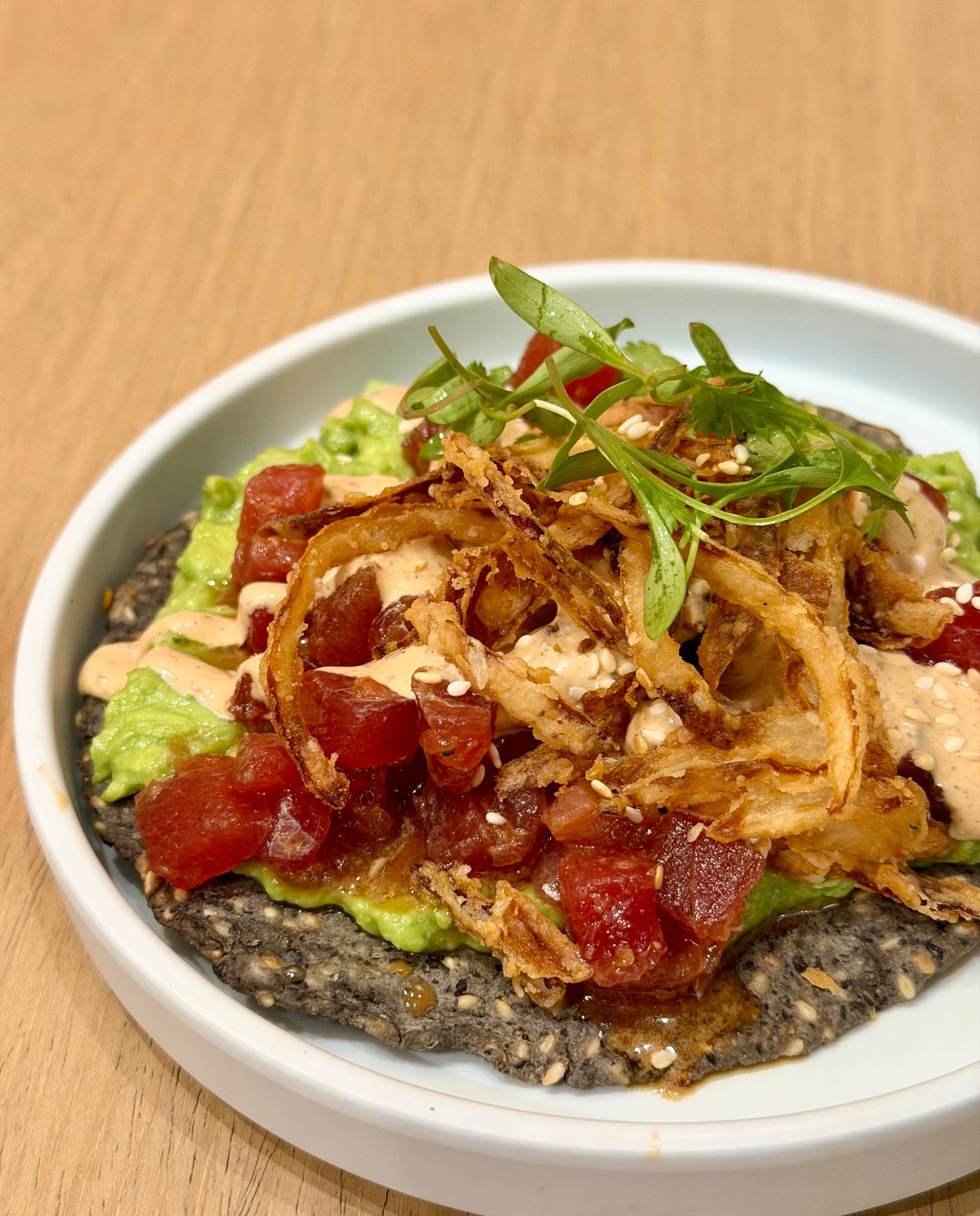 A spicy tuna tostada.