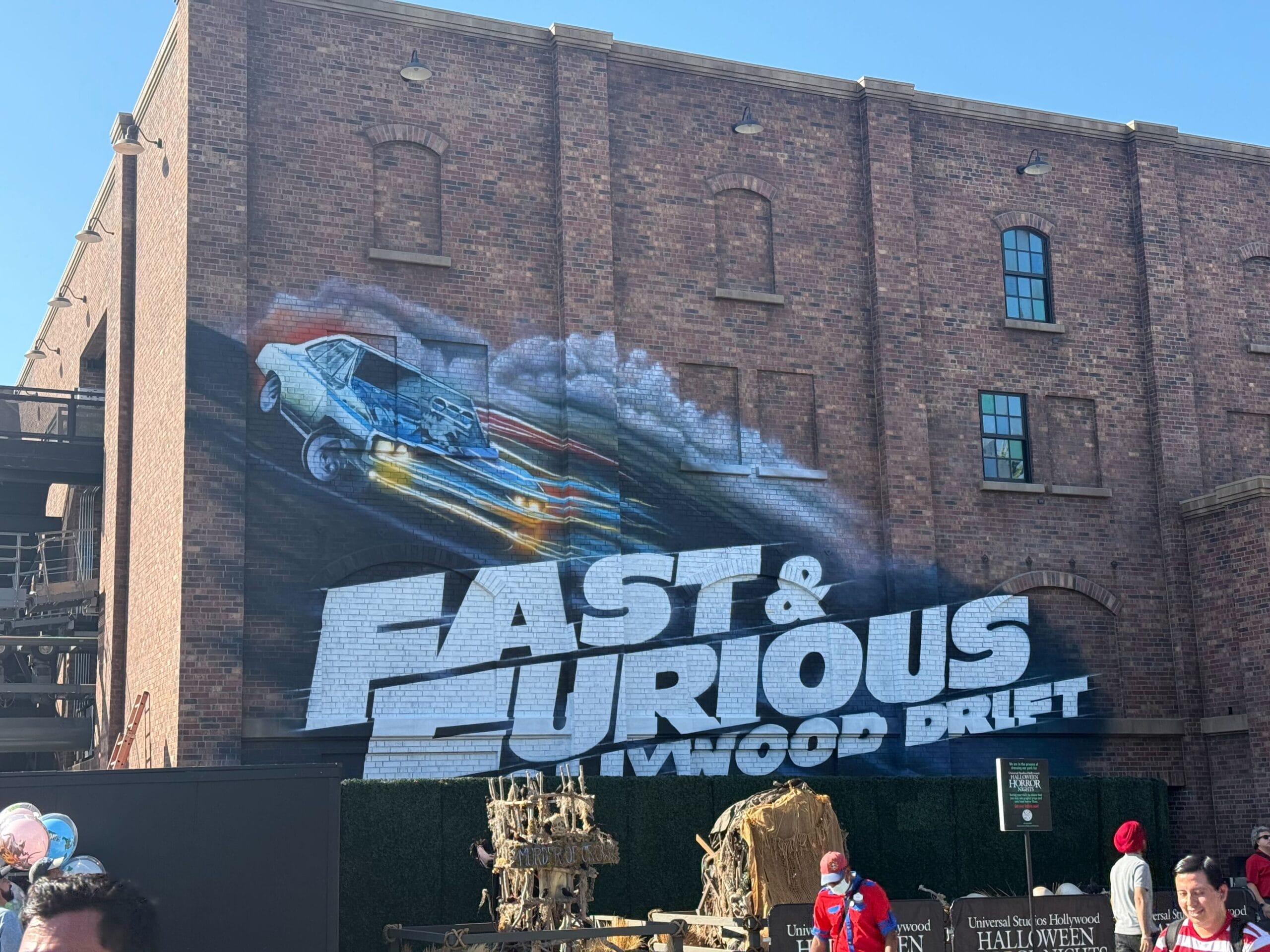 A mural of a drifting car and "Fast & Furious: Hollywood Drift" at Universal Studios—no Disney castle here like at the Disney parks.