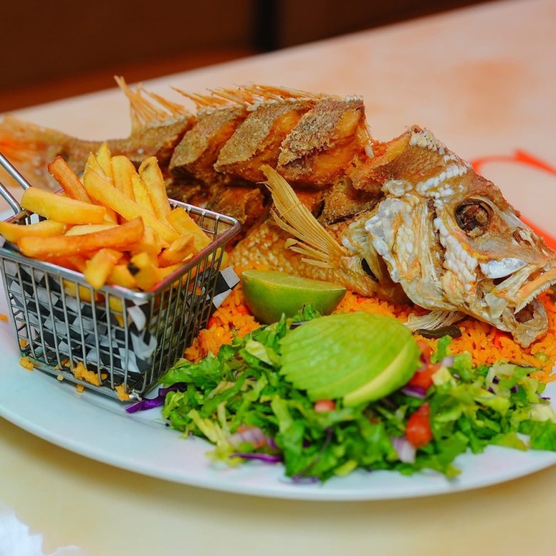 a whole cooked fish at Aguachile