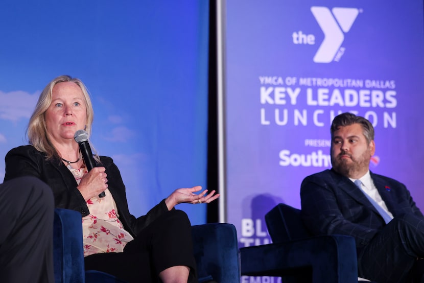 Christy Pambianchi (left), chief human resources officer of Caterpillar Inc., speaks as...