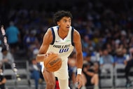 Dallas Mavericks guard Max Christie dribbles during the second half of a preseason NBA...
