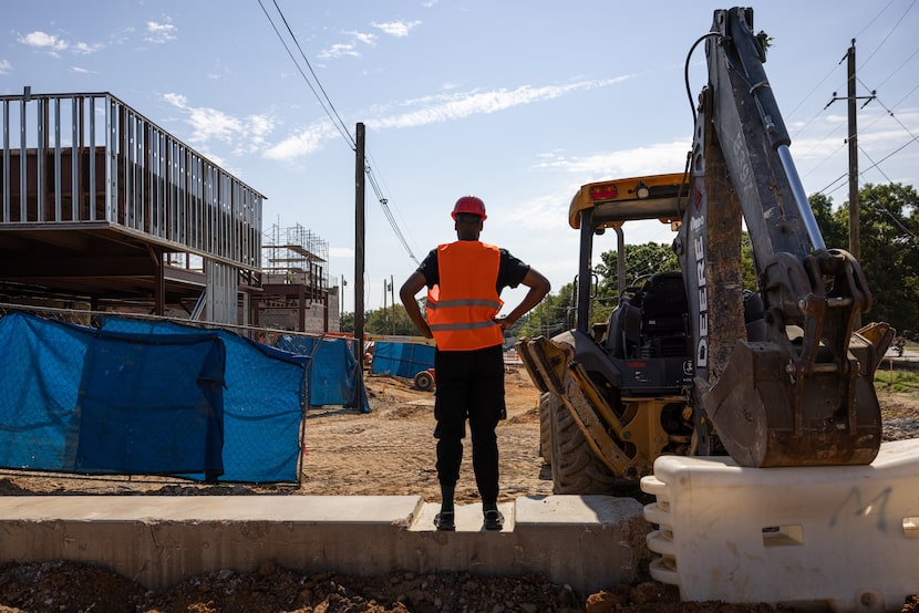 Nijeul X, executive and artistic director of the Forest Theater, looks over a fence at the...
