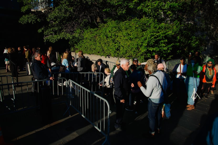 People wait outside to enter Manhattan federal court for the sentencing of Sean "Diddy"...
