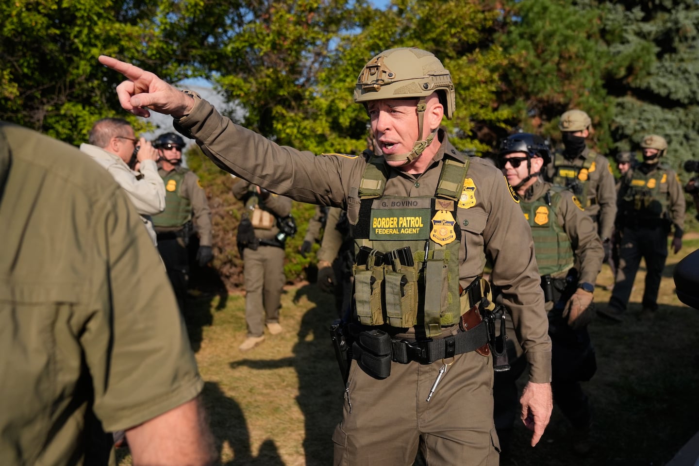 Greg Bovino, the chief patrol agent for the US Border Patrol El Centro sector, center, walks with federal immigration agents near an Immigration and Customs Enforcement facility in Broadview, Ill., on Oct. 3.