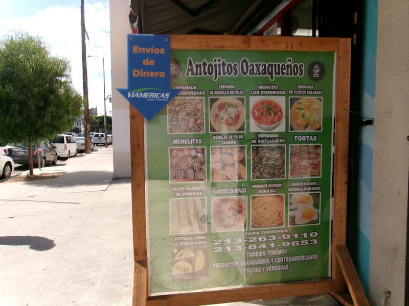 Photo of a sign that describes different Oaxacan food items.