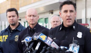 Los Angeles Fire Department Capt. Jaime Moore, right, addresses the media, Monday, Jan. 2, 2012, in Los Angeles. (AP Photo/Nick Ut)